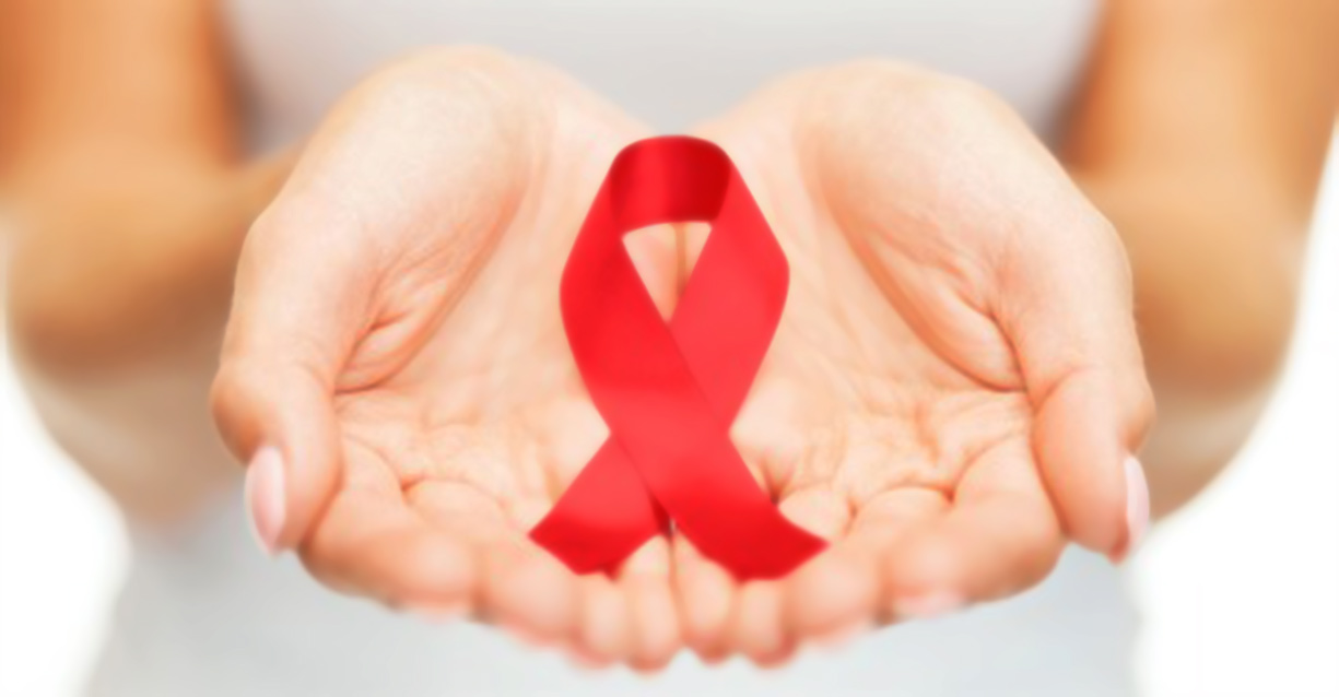 hands holding red ribbon