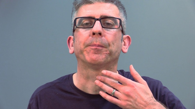 Image of person placing 3 fingers on Adams apple lump in throat
