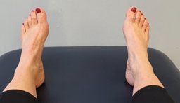 Feet flat on a bed