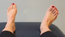 Feet on bed, toes pointing up, ankle flexed away
