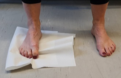 Scrunching towel up with toes