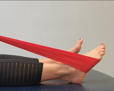 Foot wrapped with exercise band  stretching away