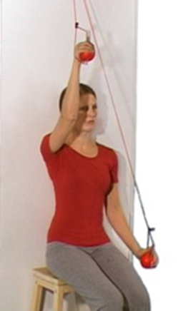 Person using pulley system to move arms up and down back is to wall