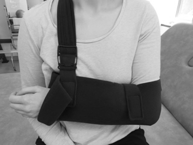 Image of long shoulder strap being attached to sling