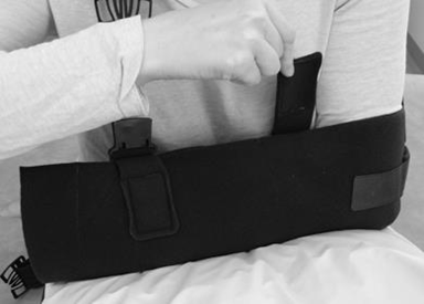 Image of sling being closed by straps