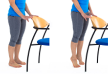 Standing on tip toes holding back of chair