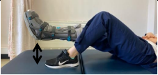 Lie flat on back and lift straight injured leg off bed