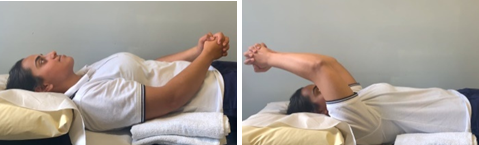 Image of person using good arm to lift injured arm over head