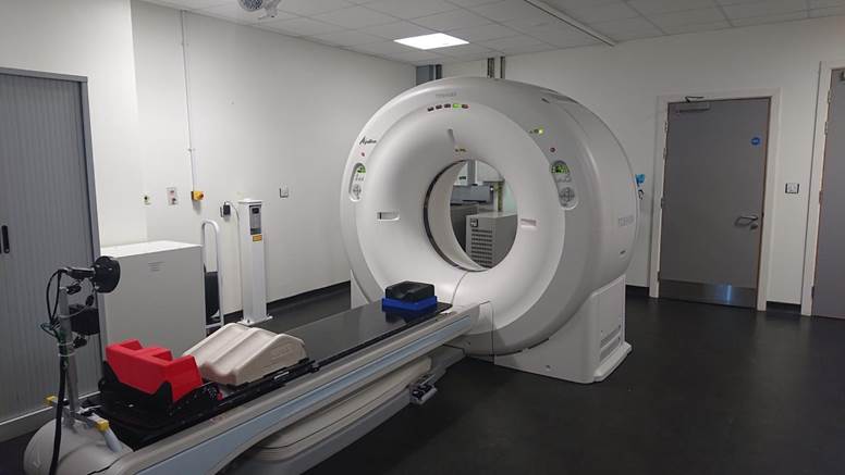 Picture of a CT scan machine in a room