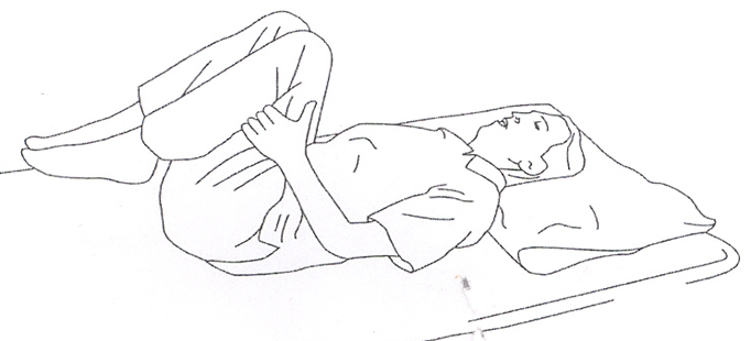 A diagram of an individual lay flat of the ground or bed pulling knees in towards their chest 