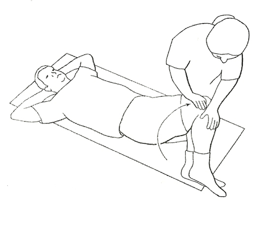 A diagram of a helper aiding an individual doing trunk rotations laying flat on the ground with bent knees twisting to the side helper is supporting knees