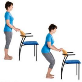 Person holding back of chair slightly squatting