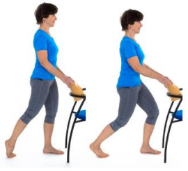 Person holding back of chair with one foot placed a stride length apart slightly bent knees hips tilted backwards