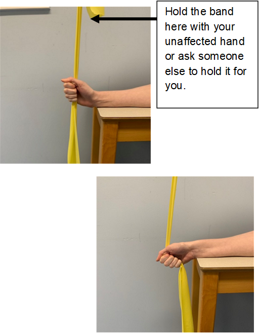 An image of a hand holding a resistance band off the edge of a table. The forearm is resting on the table. The resistance band is being held straight up by the other hand or a helper. An arrow indicates where the other hand should hold the band. A second image shows the hand is pulling the resistance band down, 