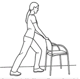 Person is holding back of chair with feet a stride apart front knee bent back leg straight to stretch calf