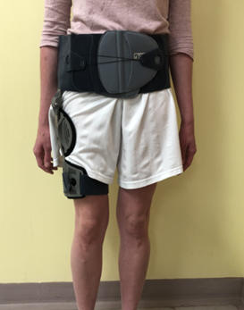 Stand wearing hip abductor brace