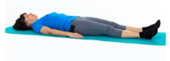 Person lay flat on back clenching buttocks