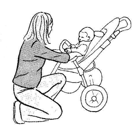 An individual is shown in a almost kneeling position attending to a young child in a pushchair