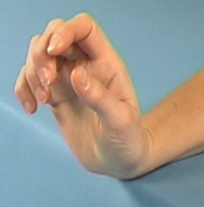 Image of arm rested on a table top with wrist at the edge so the hand can be moved up and down over edge 