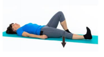 An individual laying on the ground with one knee raised whilst pressing the other knee down into the ground
