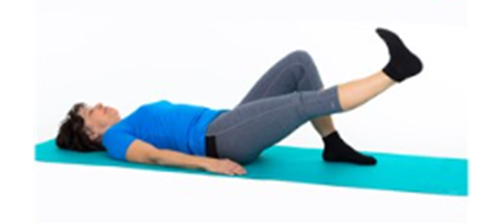 An individual laying on the ground with one knee raised whilst raising the other leg up straight as if resting it against an imaginary tree