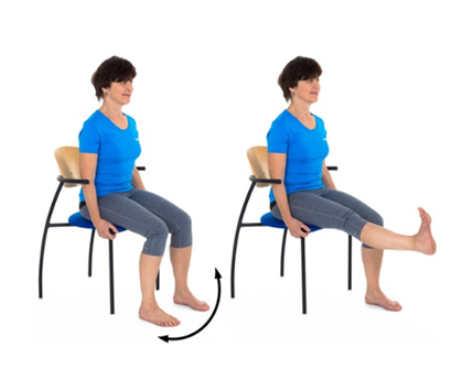 An individual sat on a chair raising leg straight out, toes pointing up 
