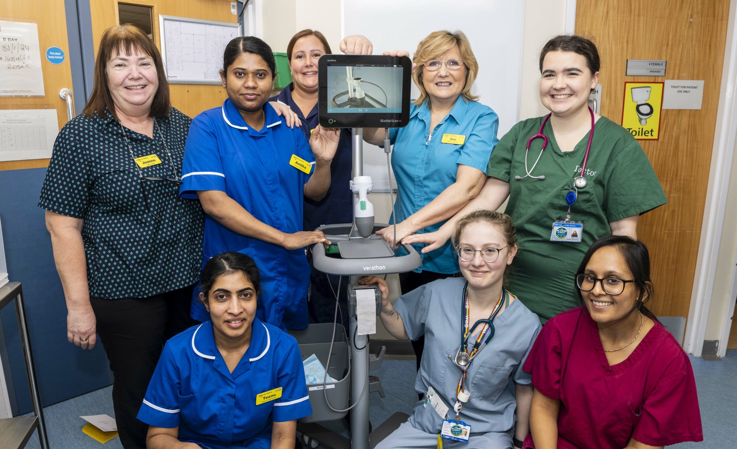 Staff from Ward 5 at the Alexandra Hospital gathered around their new bladder scanner.