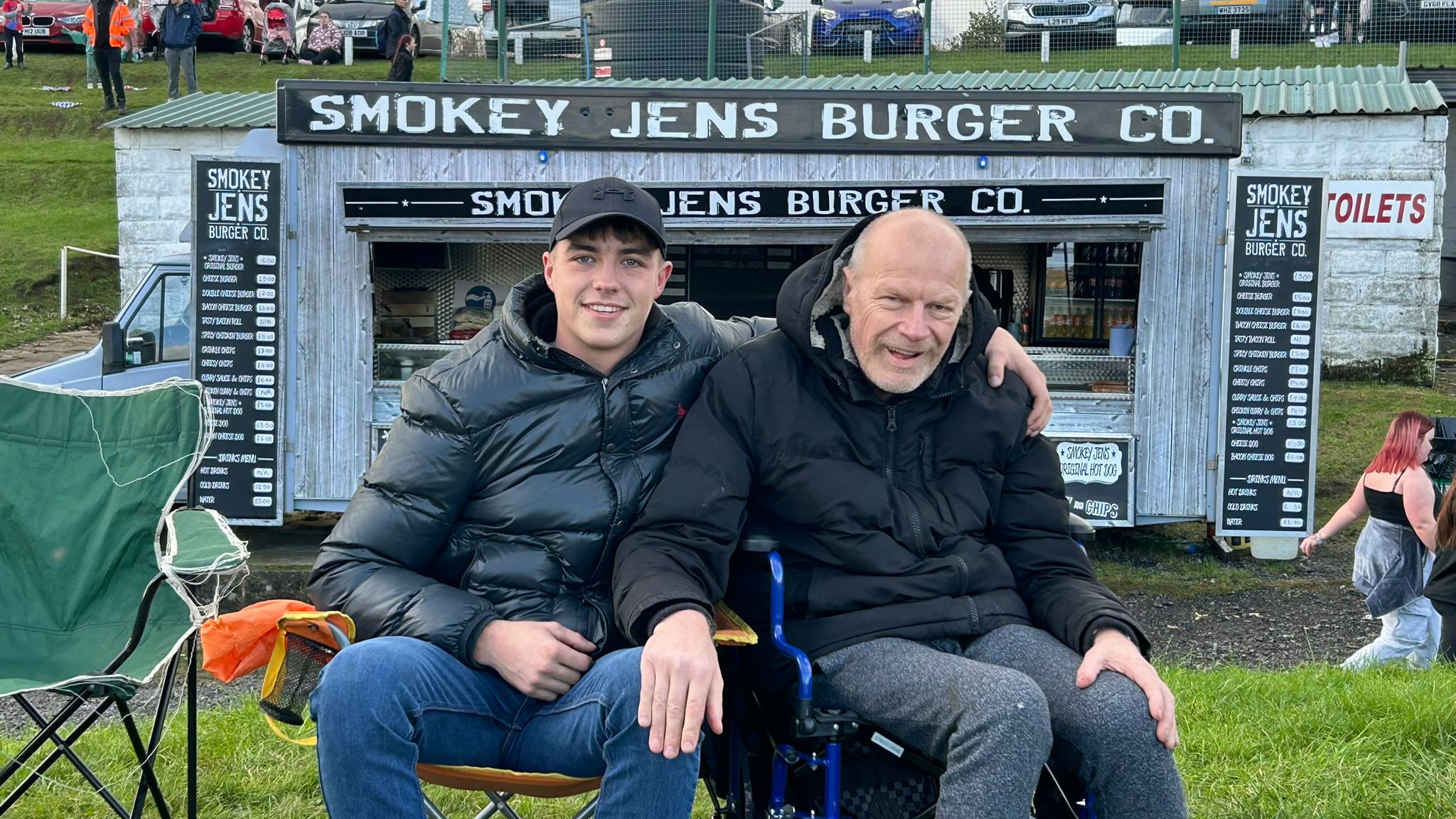 Sean sat outside with his son at an event recently.