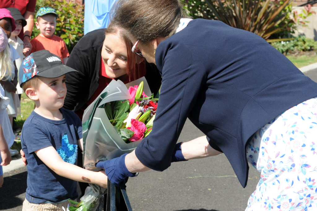 HRH The Princess Royal is greeted by children from Worcestershire Royal Hospital Creche.