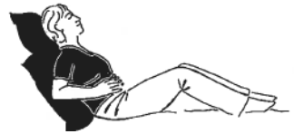 Person shown laying with back and knees supported by pillows. Hands are placed on lower belly. 