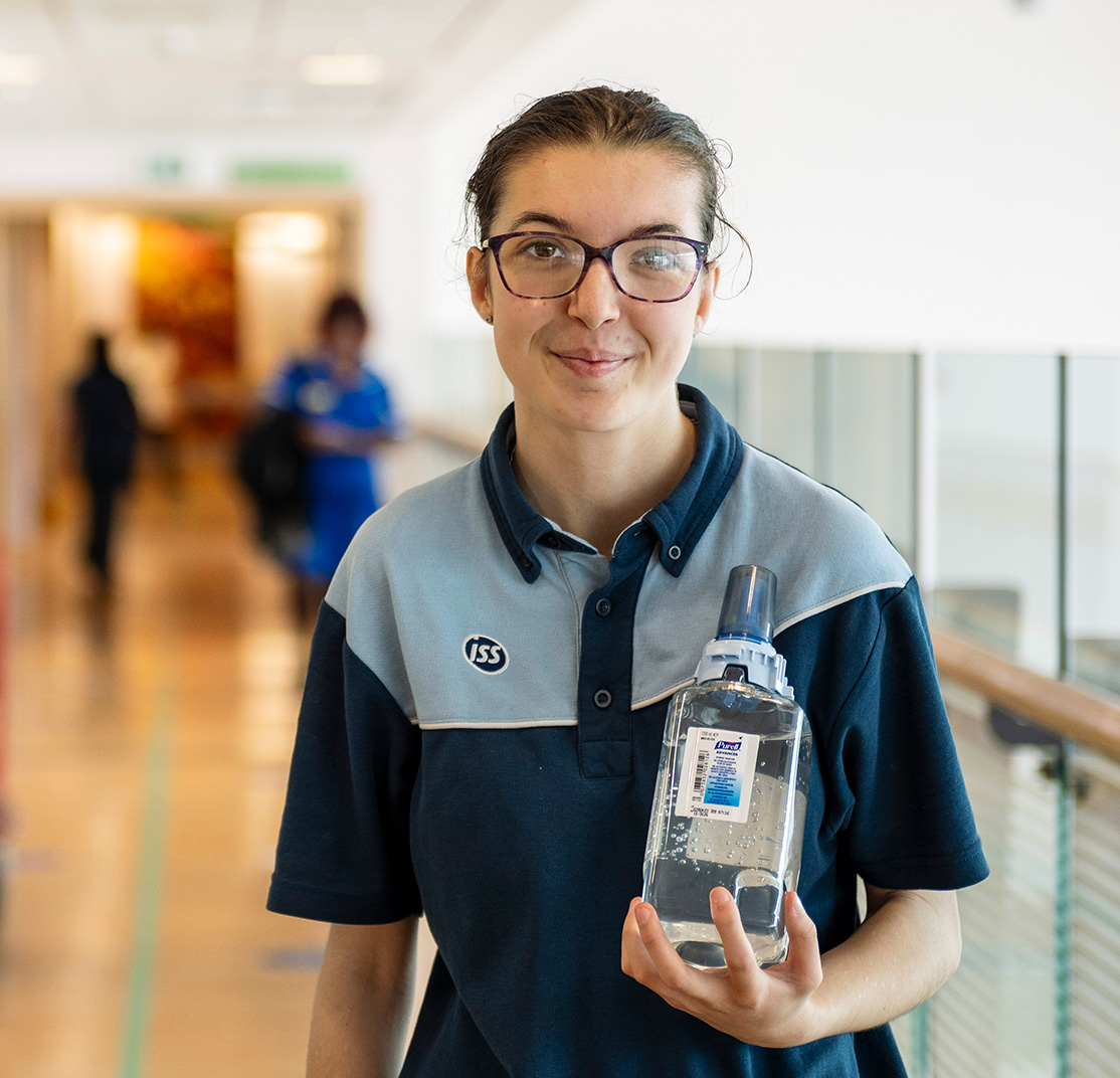 Michaela smiling standing at Worcestershire Royal Hospital in ISS uniform