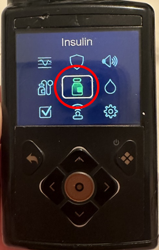 Photo of the Medtonic 780G screen, red circle shows medicine bottle