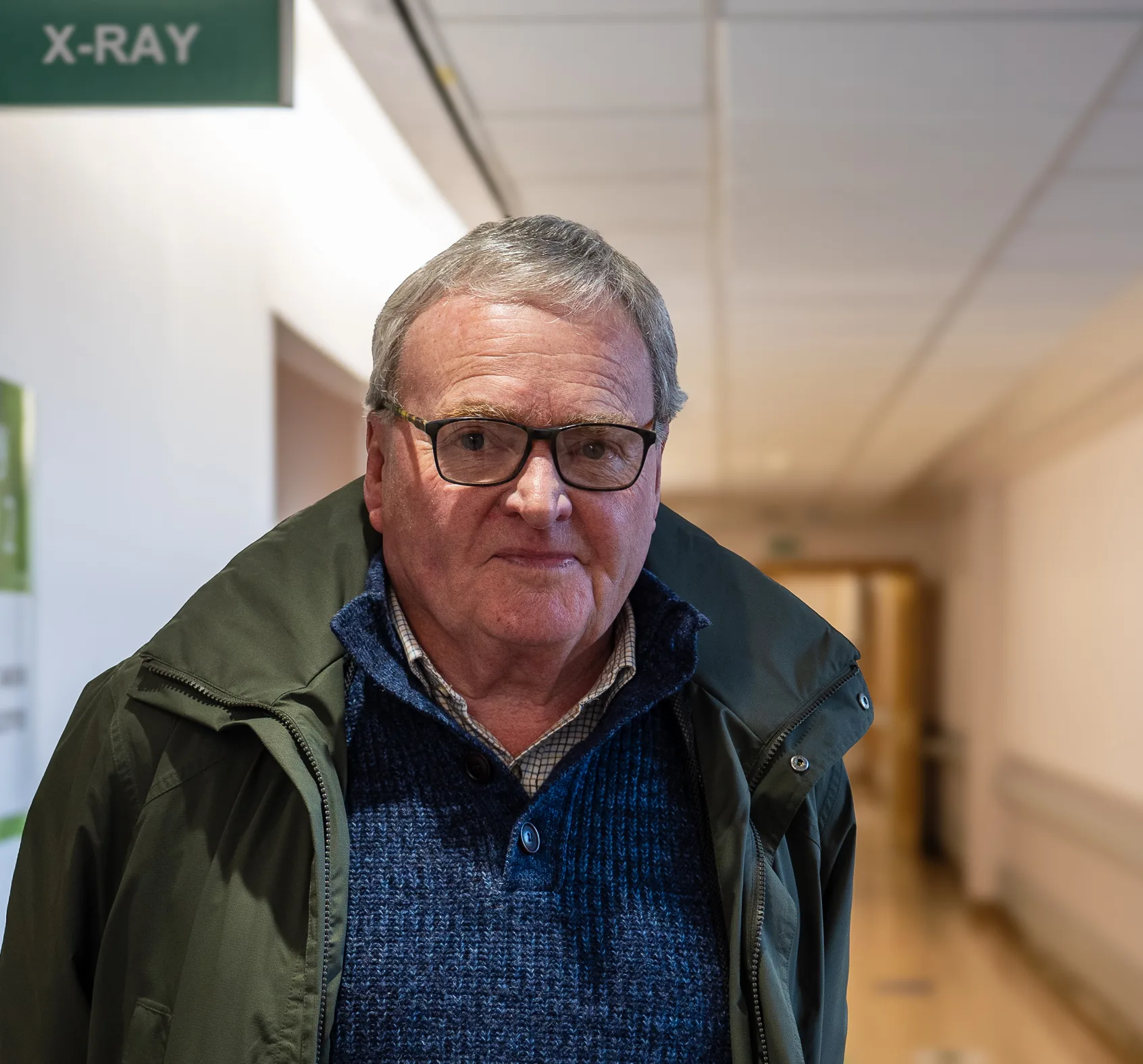 Christopher Pretty stood in Worcestershire Royal Hospital smiling at the camera.