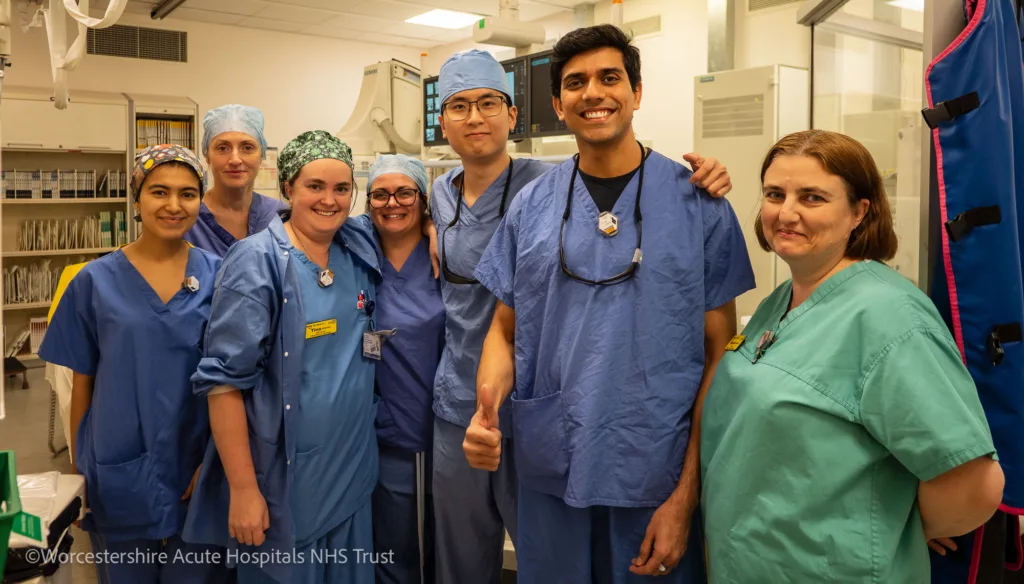 Dr Rahul Chivate surrounded by members of the Interventional Radiology team in the Interventional Radiology Suite at Worcestershire Royal Hospital.