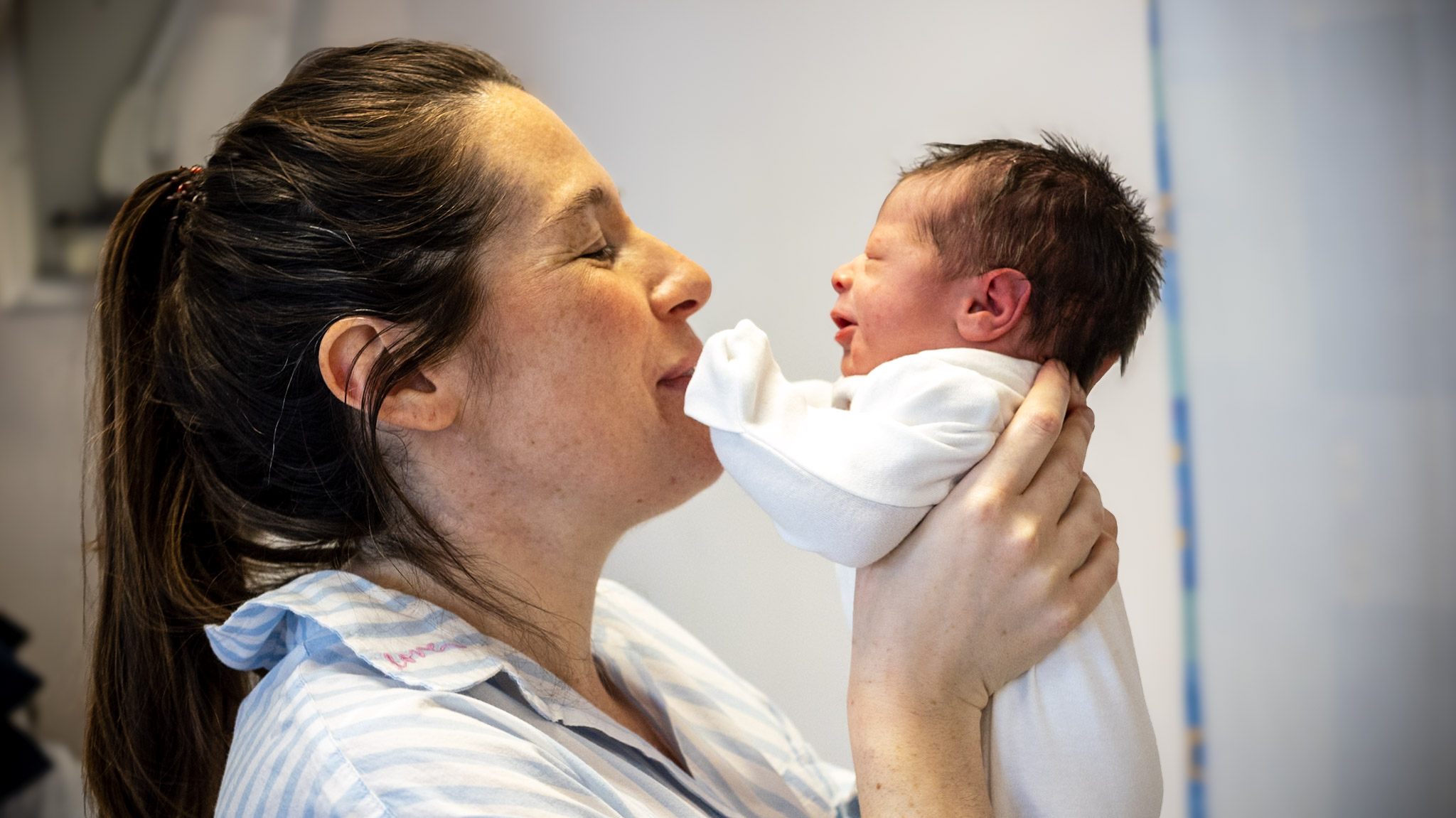 Mother holding her newborn baby