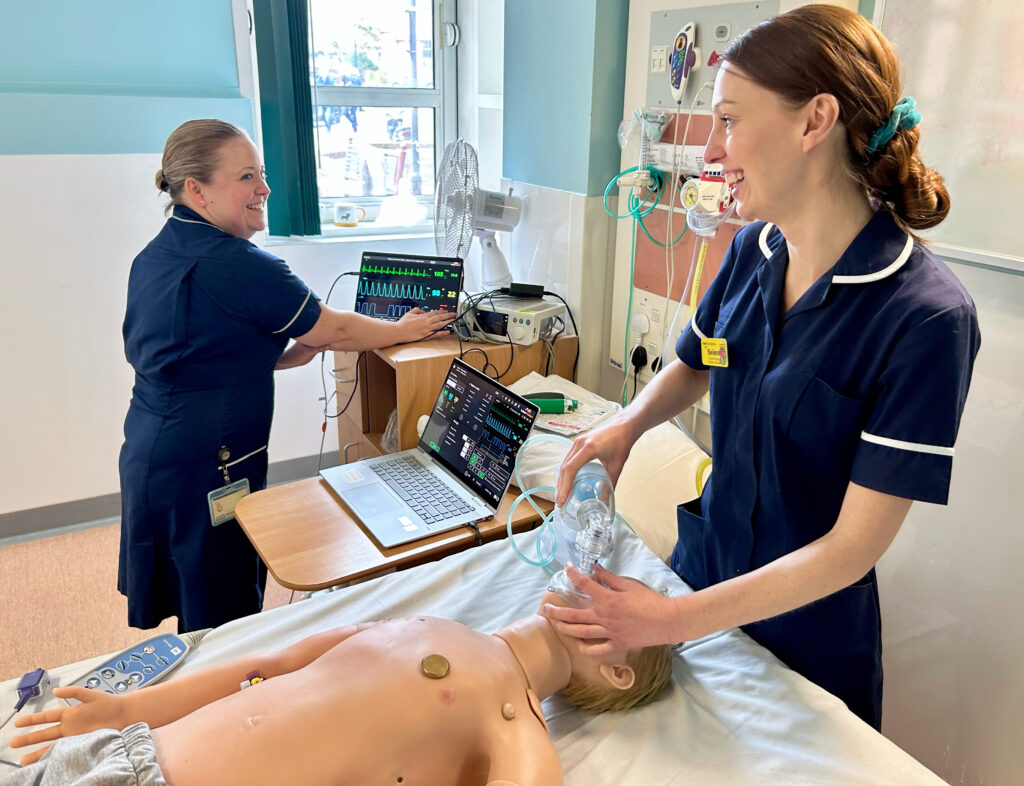 Children's nursing staff at Worcestershire Royal Hospital with Arthur, the lifelike simulation mannequin.