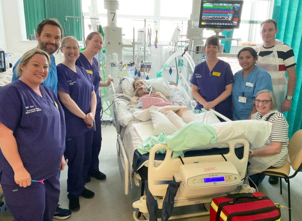 Helen getting first contact with Maeve in ICU with both on ventilation