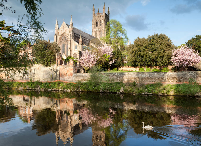 Photograph of Worcestershire Cathedral. View overlooking the River Severn. Sunny day.