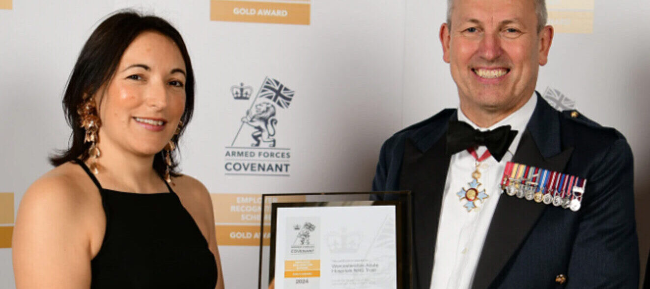 Photograph of Rebecca Brown receiving a certificate in recognition of there Gold Award status from The Armed Forces Covenant (AFC) Employer Recognition scheme.