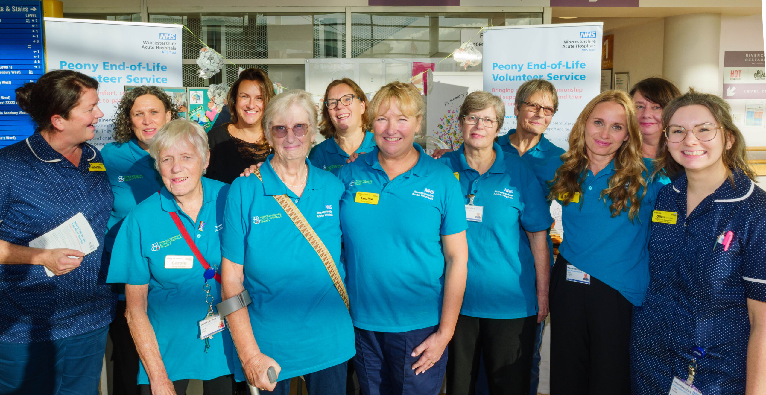 A group of new Peony Volunteers at Worcestershire Royal Hospital alongside Palliative Care nurses.