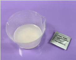 Pills dissolved in a jug and the pill blister pack on tray 