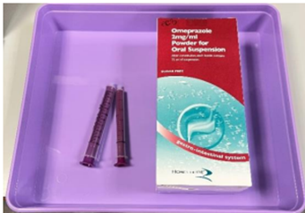 Tray with equipment for administering PPI including the oral suspension, two medicine syringes