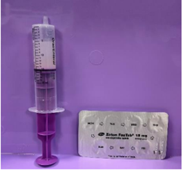 Syringe shown with solution inside, tip upright and air removed (also shows blister pack)