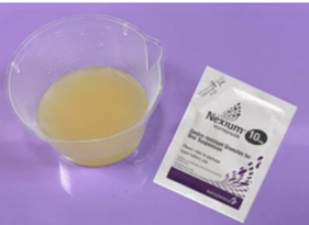 Granules dissolved in a jug and the granule sachet pack on tray 