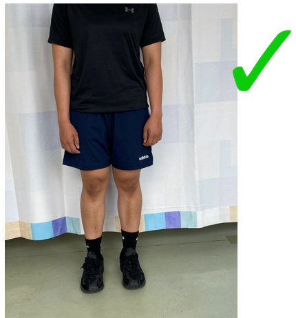 A do image with a green tick of an individual stood slouching weight onto one hip