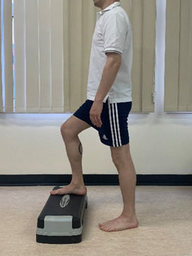 Image shows an individual stepping one foot up onto a raised step