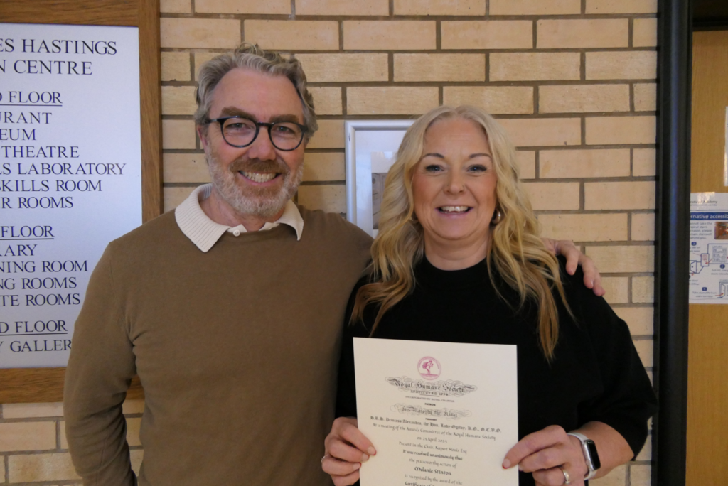Peter Prendiville and Melanie Stinton together at Worcestershire Royal Hospital, with Mel holding her certificate from the Royal Humane Society following her life saving involvement during Peter's cardiac arrest.