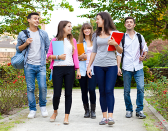 A picture of a group of young people walking along the footpath