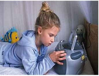 A photograph of a girl lying on the bed next to a stereo pressing buttons