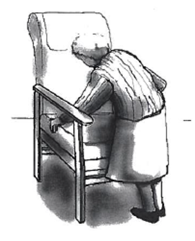 Picture of person easing to the standing position using the armchair as support
